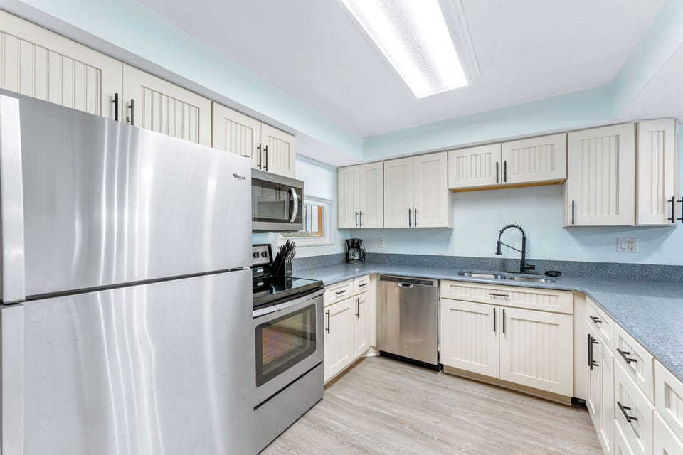 Fully equipped kitchen with modern stainless steel appliances