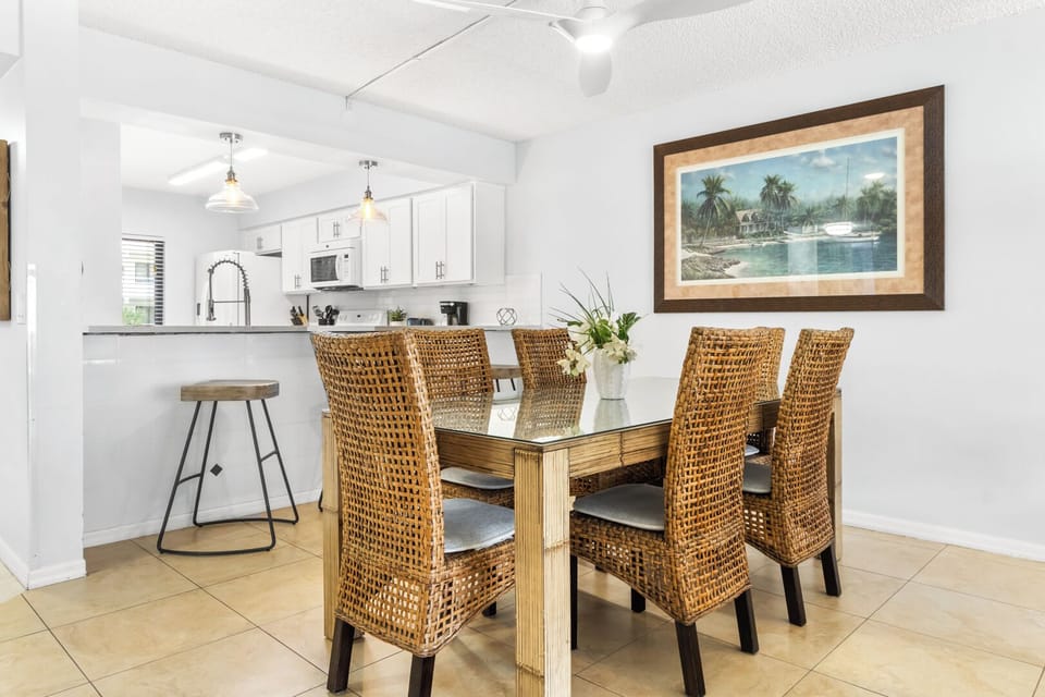 The space features a beautiful dining table that comfortably seats six.