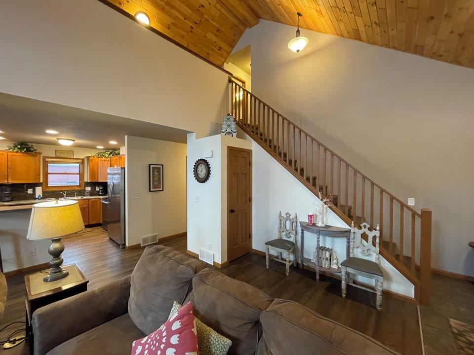 Living Room with Cozy Seating, Queen Sofa Sleeper, TV & Fireplace