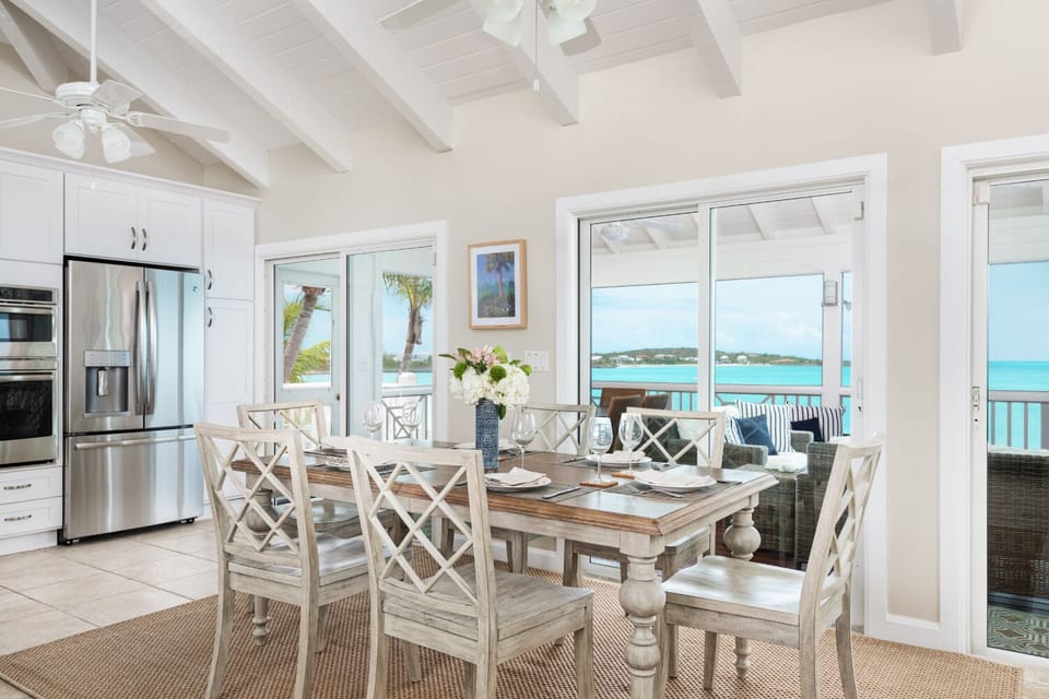 The dining table has seating for 6 and views of the ocean