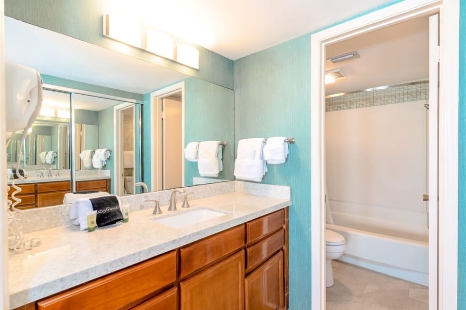 Our primary bedroom has amble vanity space, a large closet, as well as a shower/tub combo.