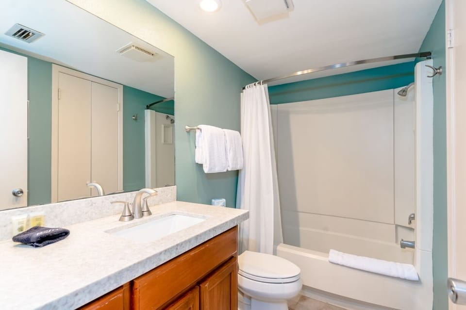 No need to queue for the bathroom. Our full guest bathroom includes a vanity with sink, closet, toilet, and shower/tub combo.