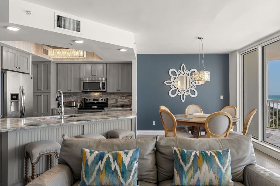 Enjoy an open-plan living space where elegant décor meets coastal comfort, complete with ocean views from your private balcony.