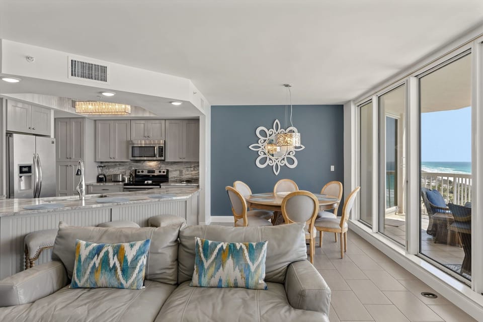 Your spacious living space flows seamlessly from kitchen to ocean-view balcony, creating the perfect beach retreat for relaxing.
