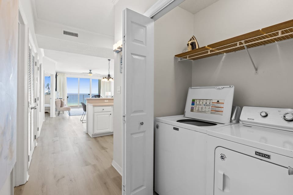 Laundry Closet - Full size washer & dryer for all your laundry needs.   Store your soaps & dryer sheets on the shelve.