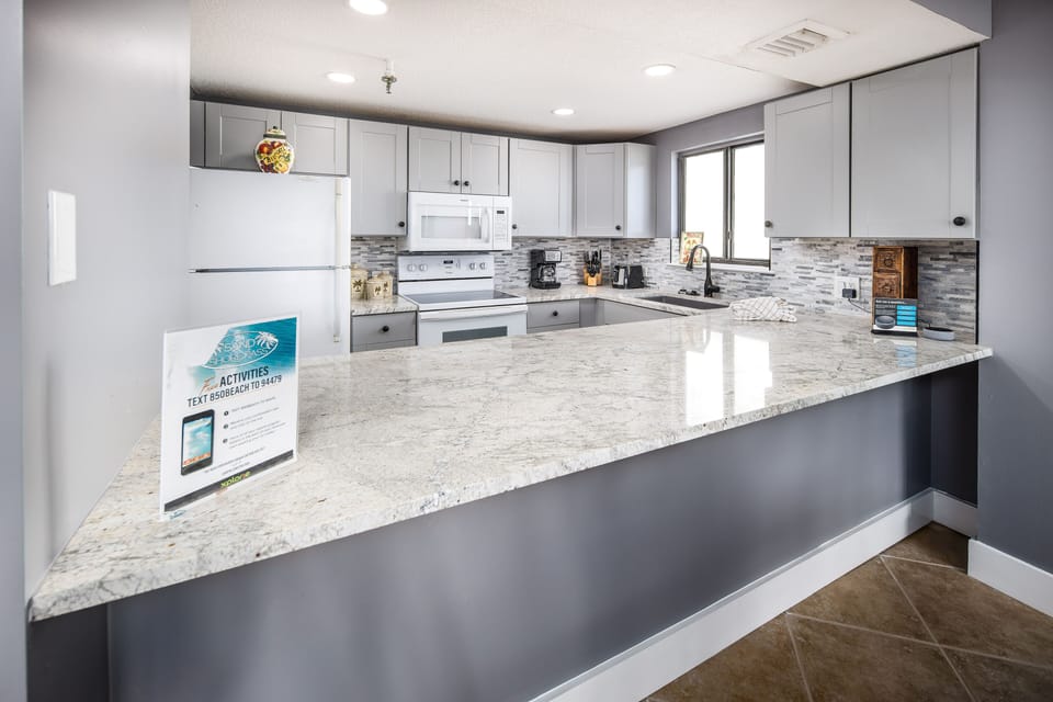Kitchen - Granite counter tops and beautiful white cabinetry