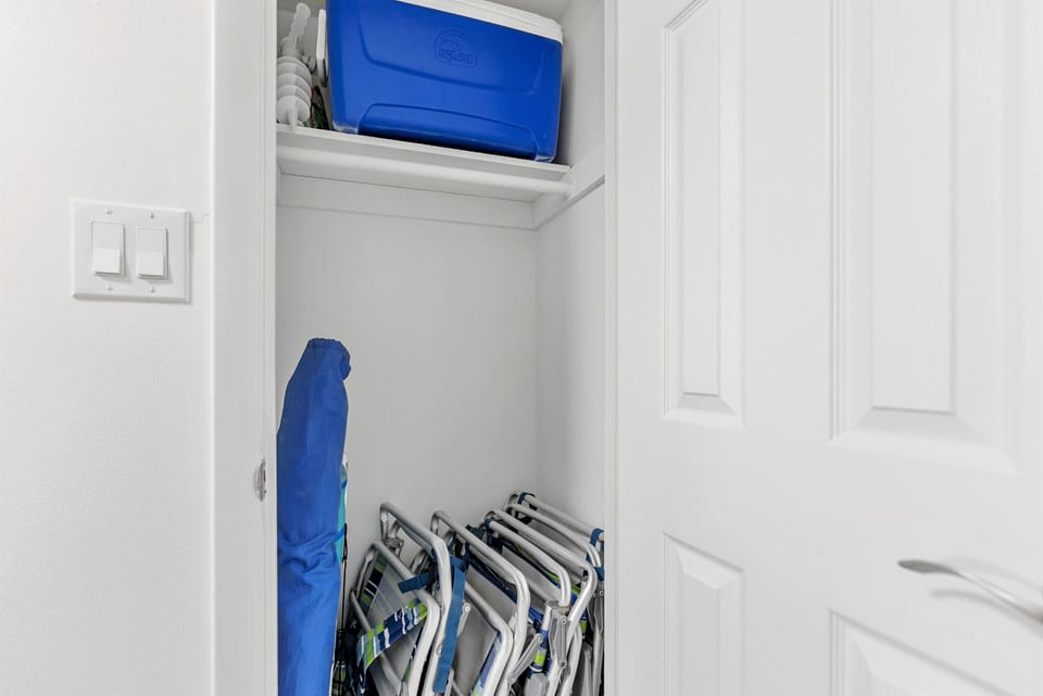 Beach amenities like beach chair, shuffle board, cooler and umbrella