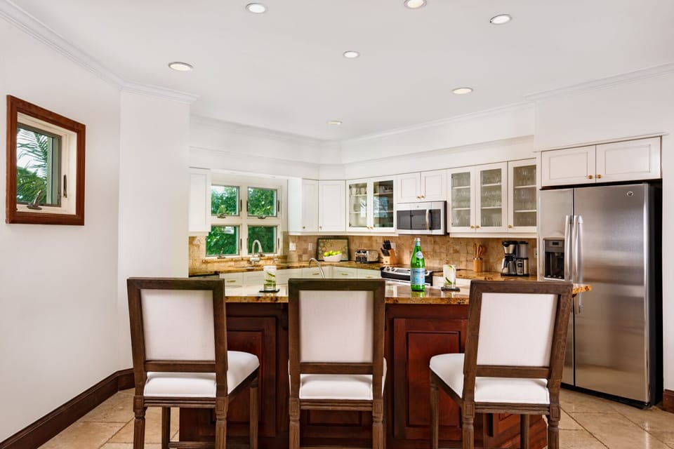 The kitchen has 3 pull up barstools and plenty of room to cook.