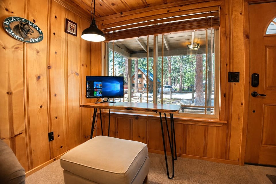 Catch up on work or stream your favorite shows at this sleek desk with a forest view, where you'll enjoy the perfect blend of productivity and natural serenity just outside your window.