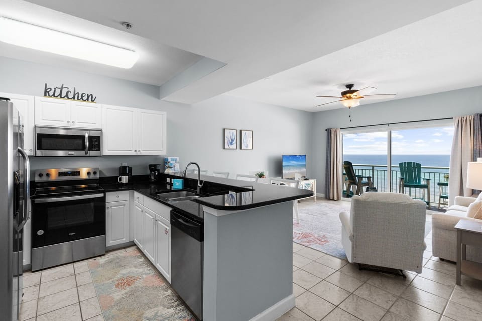 Kitchen - Great appliances and all you need to whip up a delicious meal. Save on the vacay budget by dining IN with a view still!!