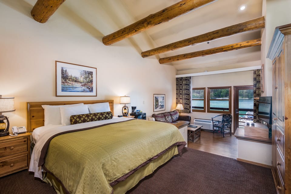 Deluxe Suite, 1 King Bed with Sofa bed, Jetted Tub, Lake View | 1 bedroom, desk, blackout drapes, iron/ironing board