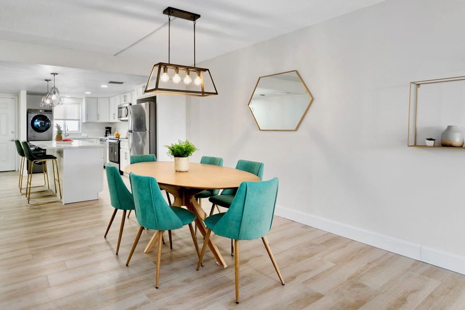 Chic dining area with contemporary seating for six, perfect for gathering.