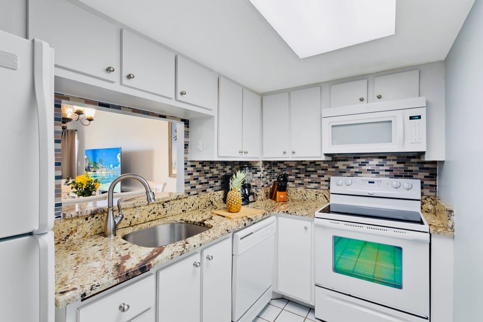 Modern kitchen with sleek granite countertops and all essential appliances