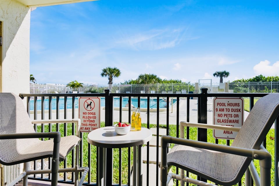 Walk right out to the pool and beach!

Note: The patio enclosure was removed during the recent balcony restoration project. The patio is no longer gated.