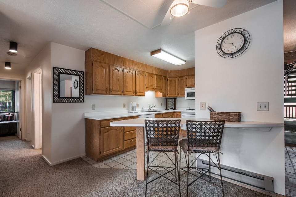The kitchen has been updated with new counters, breakfast bar with seating for two (2) and complete with appliances.