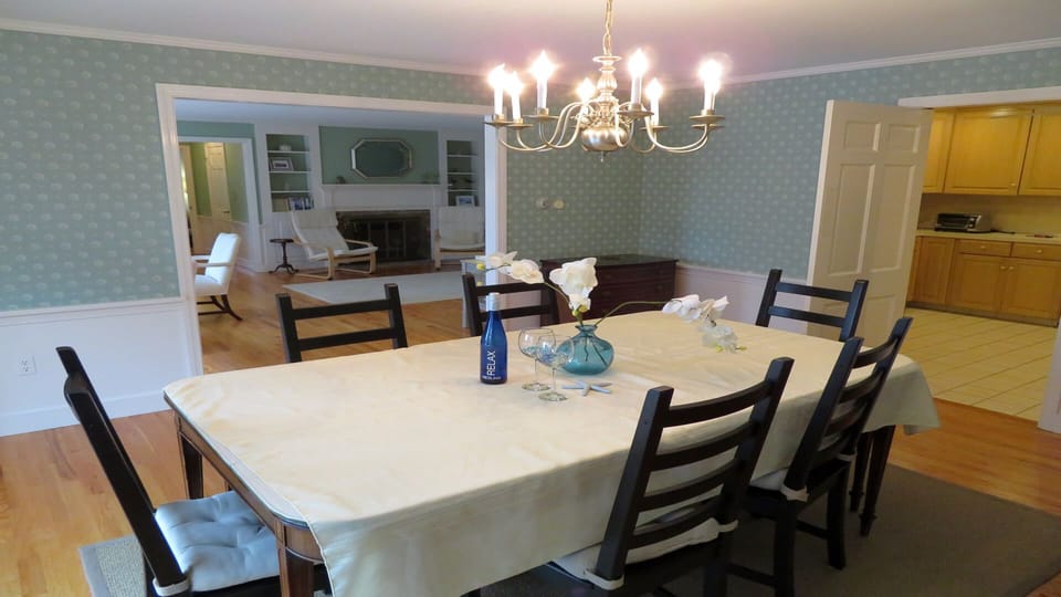 Dining room - easy access from kitchen and open to living room with views - open to sun deck with awning - Waterfront North Chatham Cape Cod New England Vacation Rentals