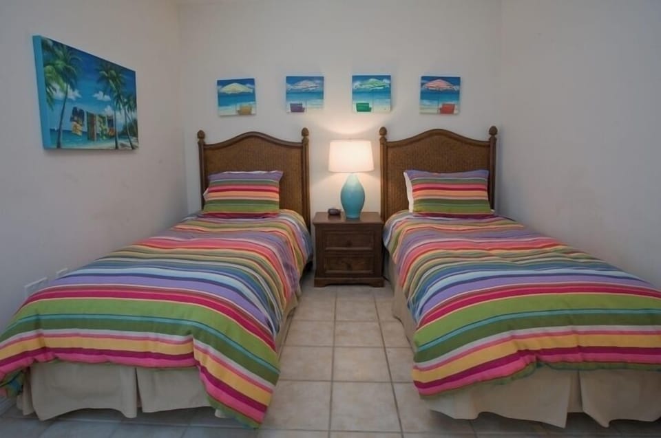 The guest bedroom is ideal for the kiddos with matching twin beds.
