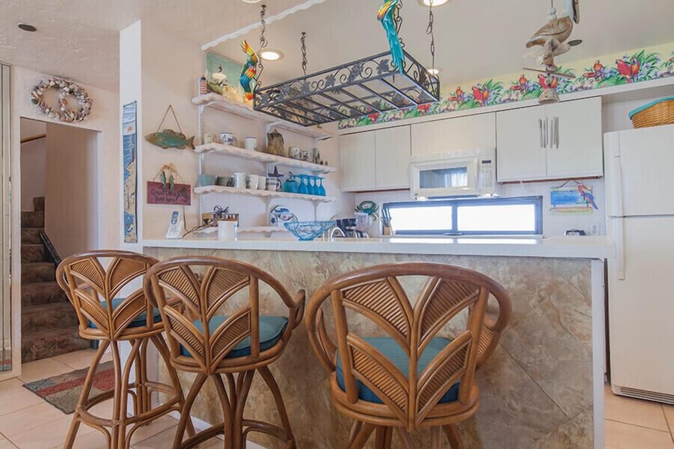 Our quirky little kitchen has seating for three.