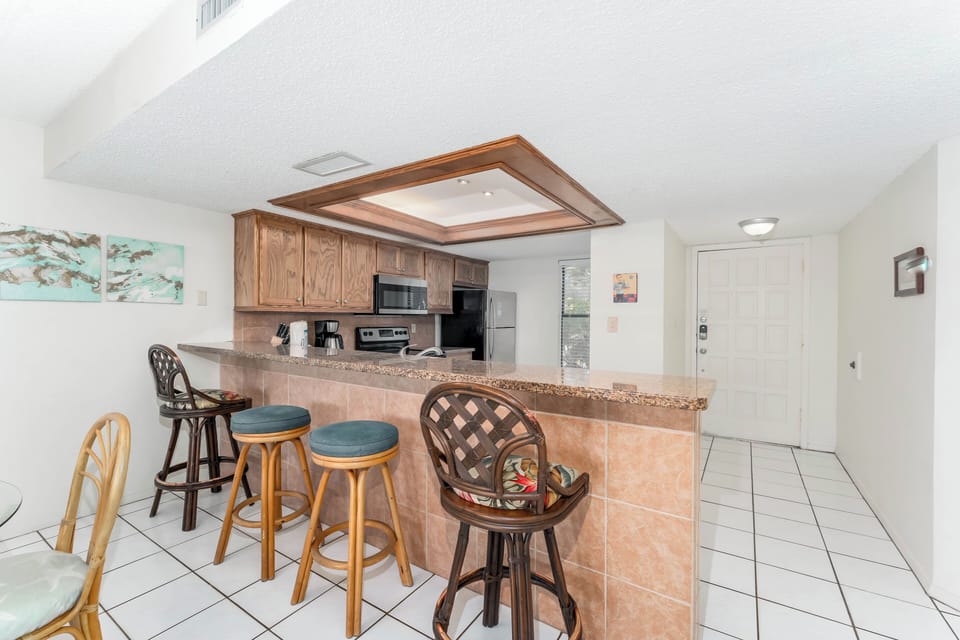 Your guests can pull up a bar stool and look into the kitchen while you cook and entertain.
