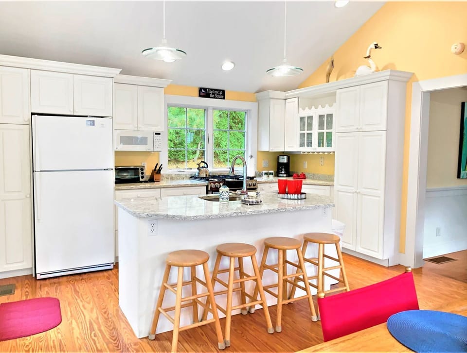 Eating area. Dining table and breakfast bar-Plenty of seating for the entire family- 58 Longs Lane Chatham Cape Cod New England Vacation Rentals