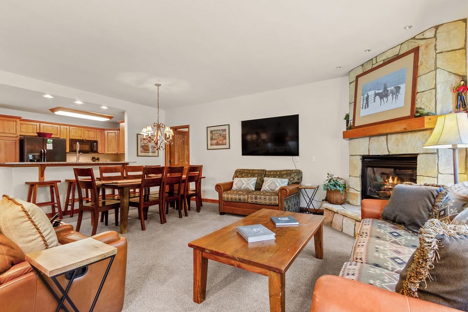 Gather around the crackling fireplace, unwind on the cozy sofas, and share meals at your spacious dining table while mountain memories come alive on the big screen TV.