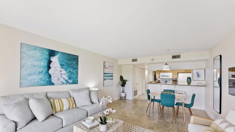 Spacious open-concept living area with modern furnishings and decor.