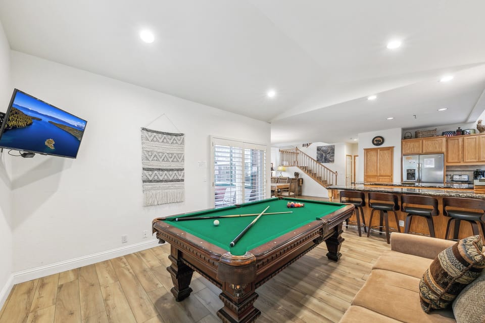 Challenge friends to pool while your favorite show streams on the wall-mounted TV in this entertaining space.