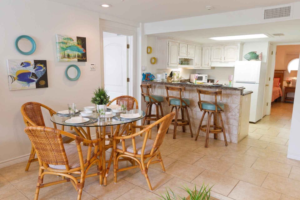 The dining table seats four with more seating at the kitchen bar!