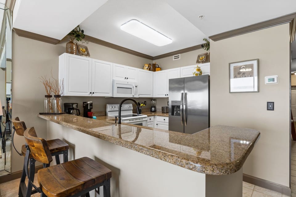Ktichen - You have extra cooking space here. The smooth range stove makes cooking a breeze. F