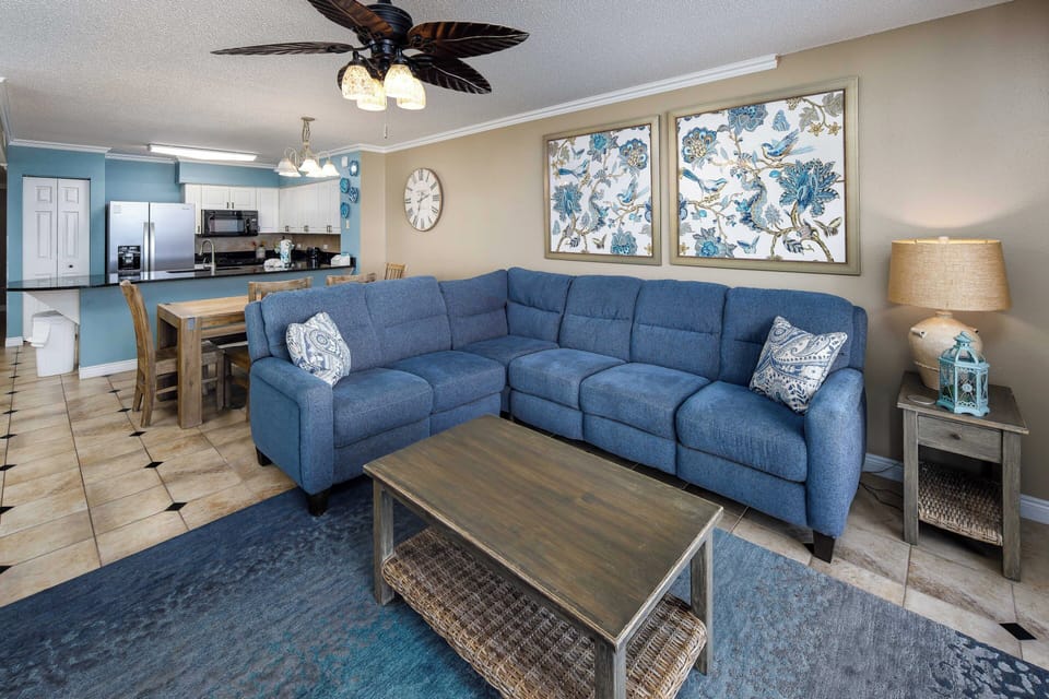 Living Room - Great open floor plan with gorgeous tile flooring that gives this unit a sophisticated and chic atmosphere throughout.