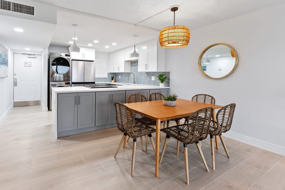 An elegant dining area with a spacious open kitchen