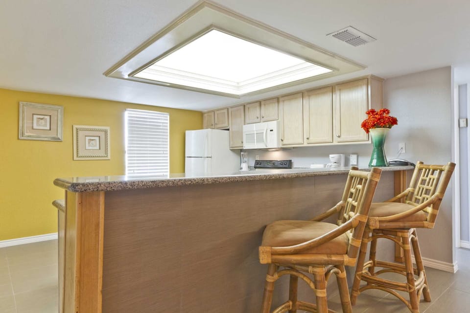 Entertaining the kids or keeping snacks out is convenient with our kitchen bar!