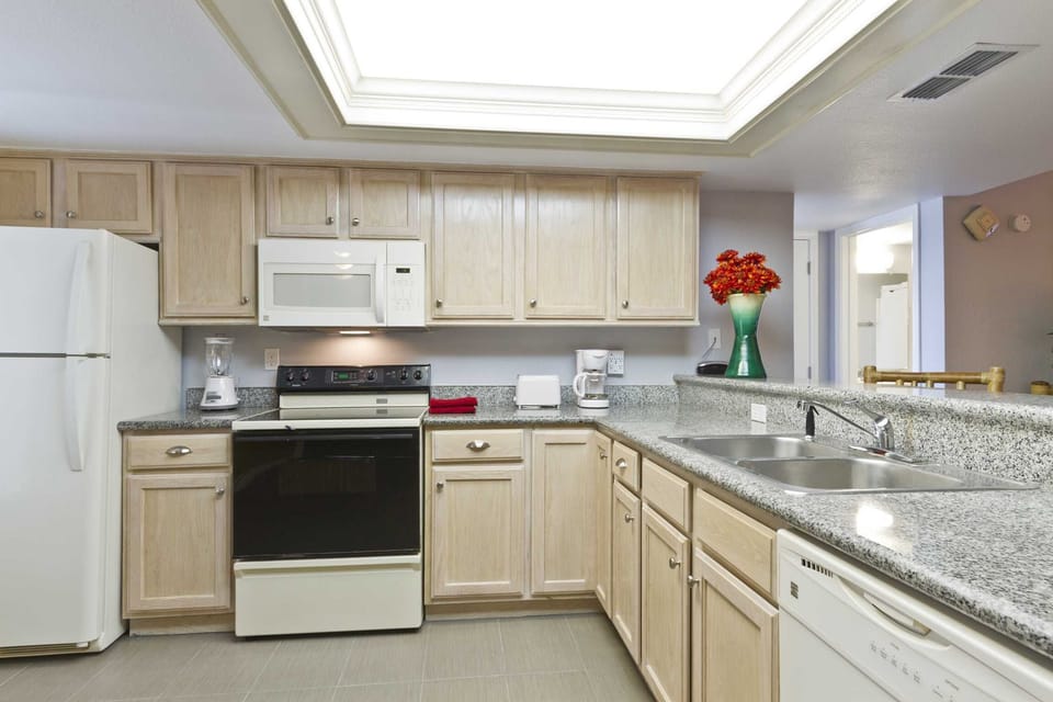 Our kitchen is practically on the beach! Whip up your favorite meals in our spacious kitchen. Grab the fresh produce you need at the charming beach grocery, Blue Marlin!