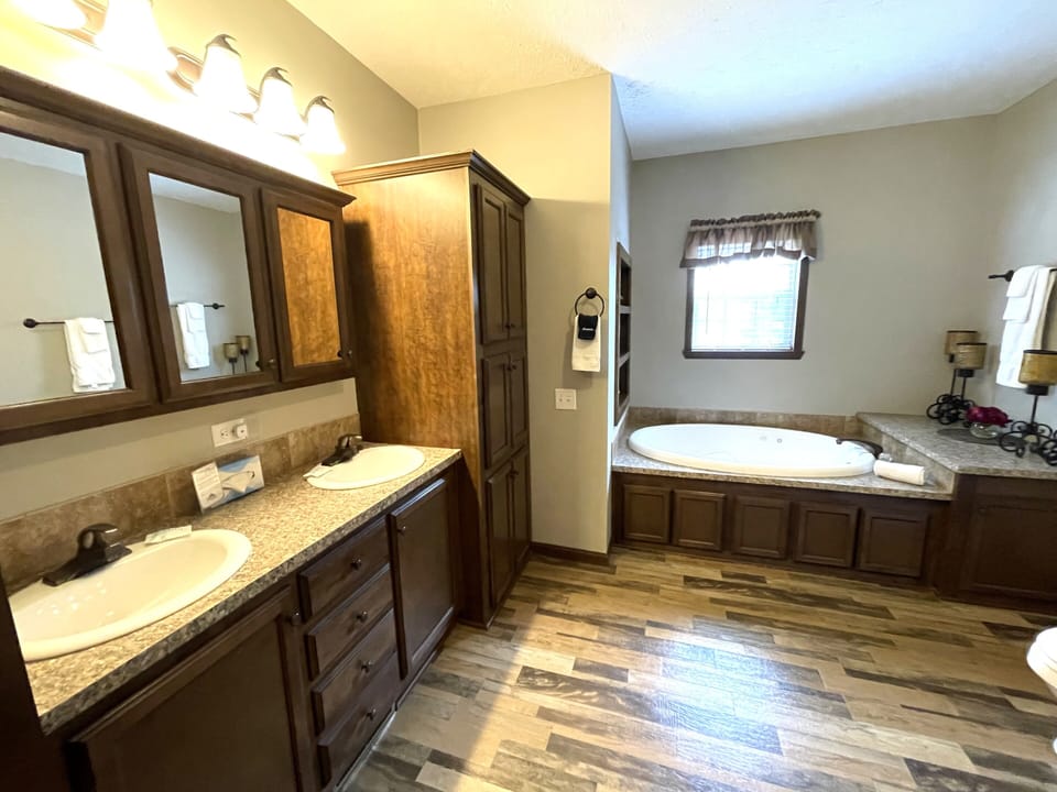 Primary Bathroom 1 with Walk-In Shower & Whirlpool Tub on Main Level