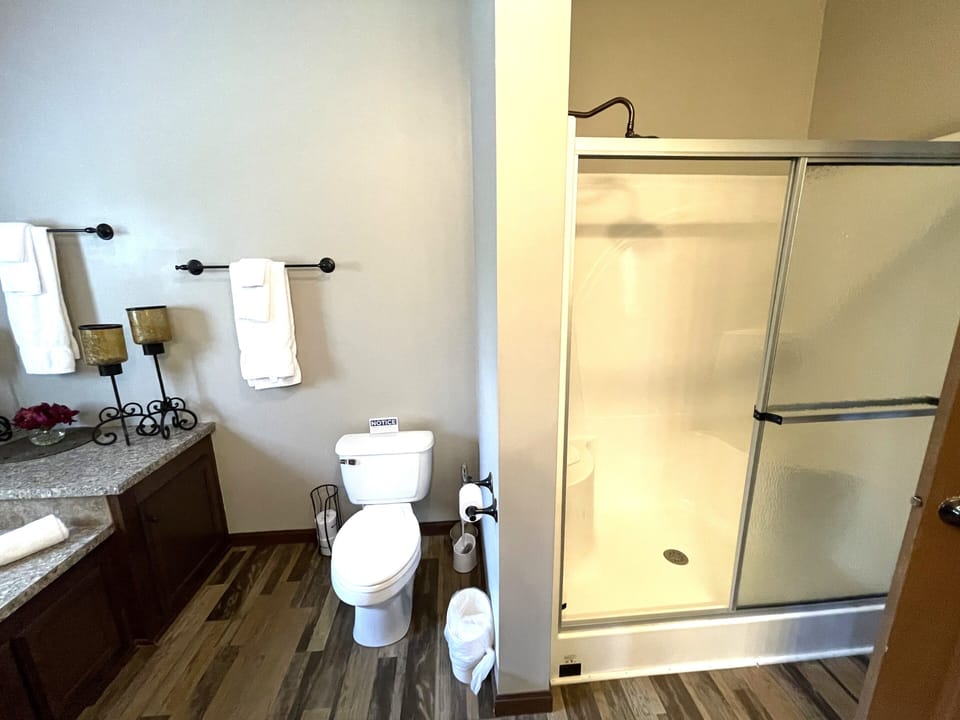 Primary Bathroom 1 with Walk-In Shower & Whirlpool Tub on Main Level