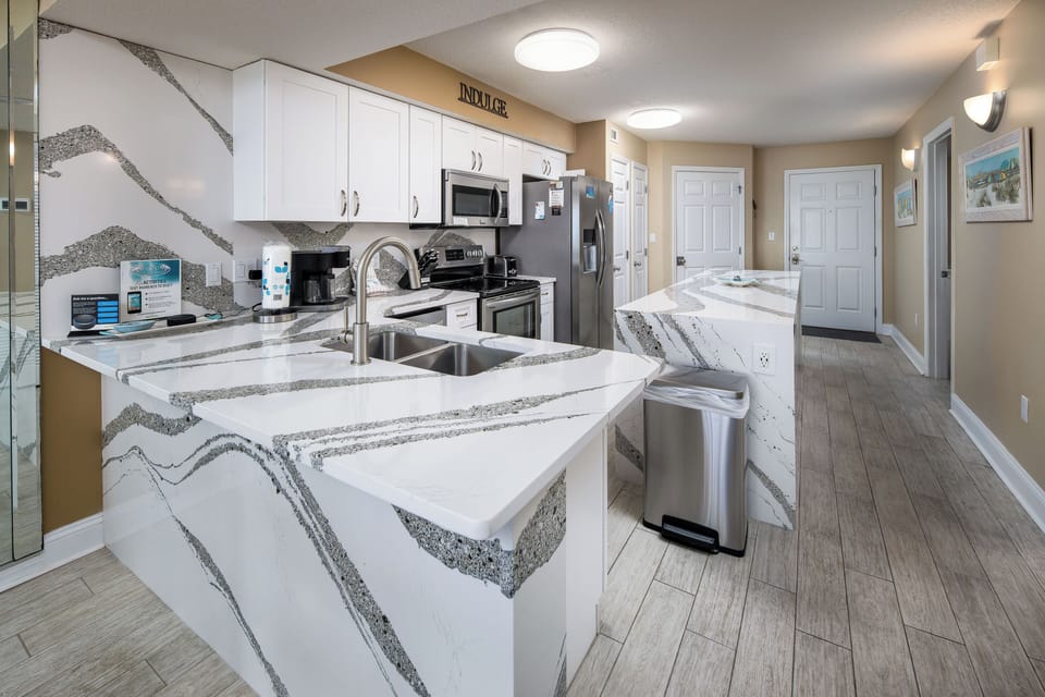 Kitchen - Stainless steel appliances, white cabinetry, and so much counter space!