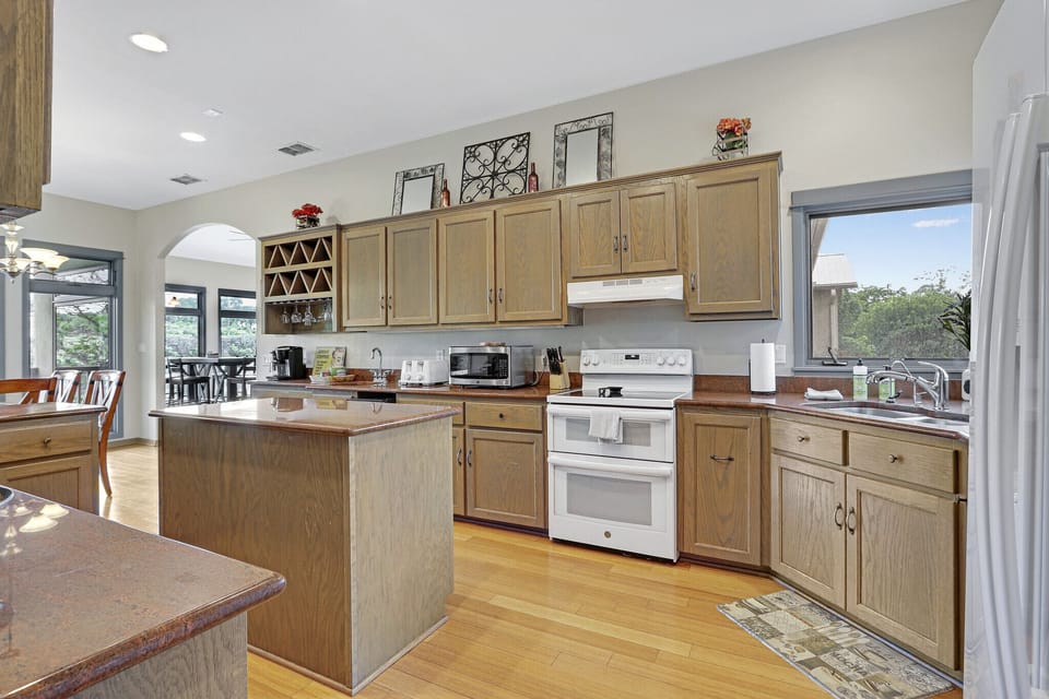Fully equipped kitchen with additional dining area.