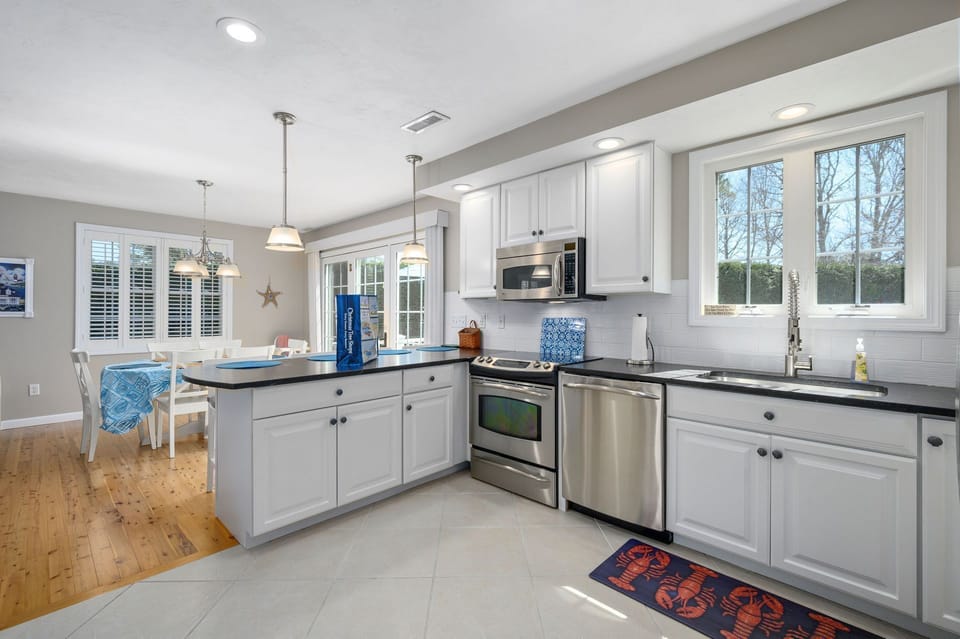 Open floorplan allows for everyone to be included in the conversation - 9 Wilfin Road South Yarmouth Cape Cod - Four Shore - NEVR