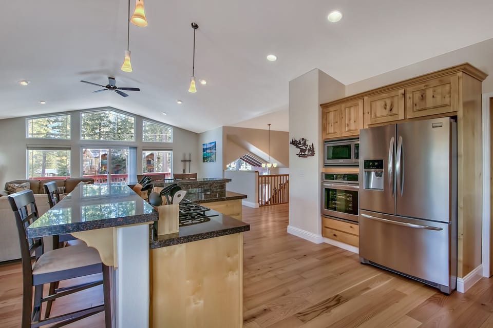 Your gourmet kitchen awaits with granite counters, stainless steel appliances, and a breakfast bar perfect for morning coffee.