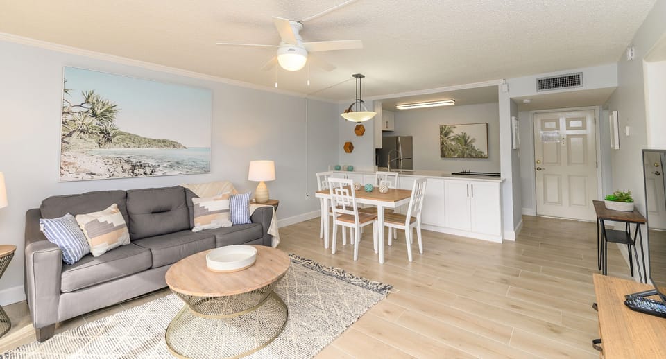 Spacious open-concept living and dining area with modern coastal décor