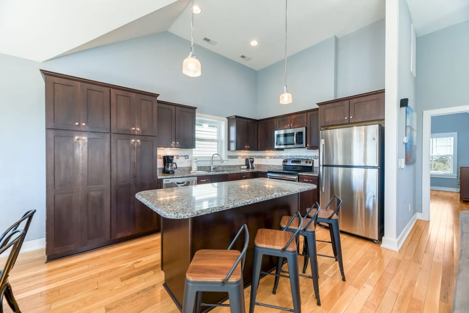 Kitchen with Bar Seating on Third Level