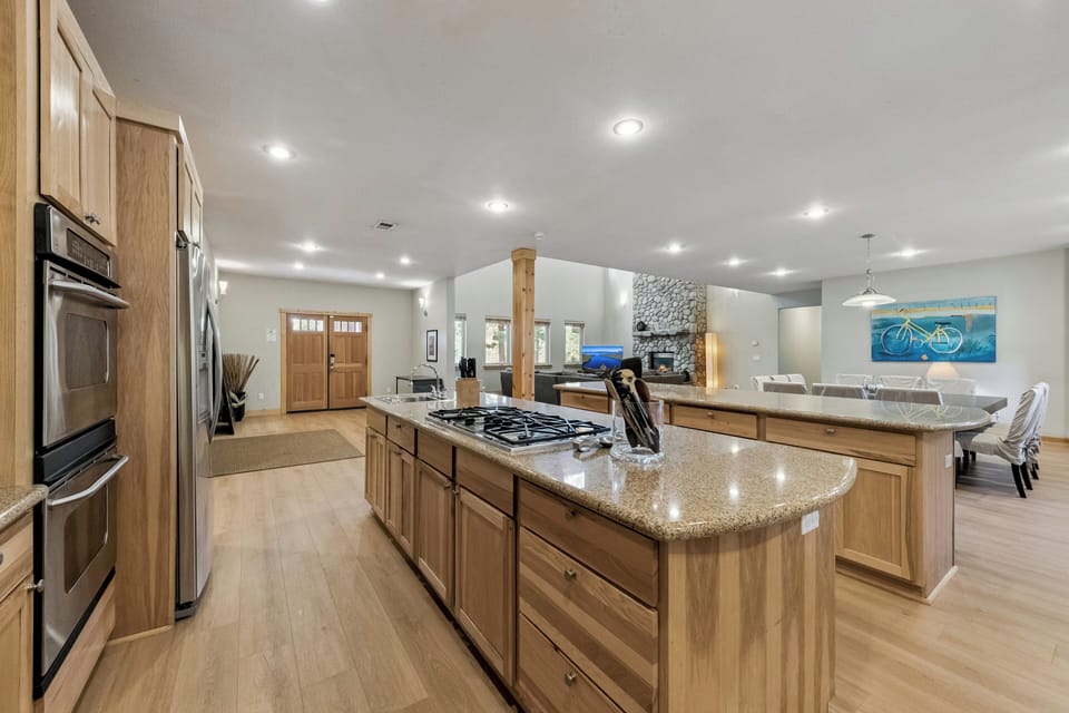 Your spacious gourmet kitchen features granite counters, premium appliances, and flows seamlessly into the living area for memorable gatherings.