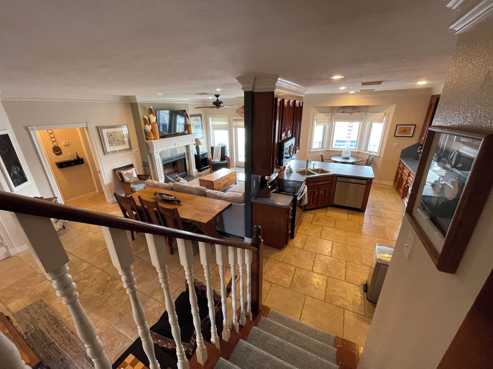 Living and kitchen from stairs to 4th bedroom.