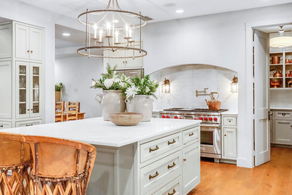 A gourmet kitchen awaits with marble countertops and professional-grade appliances - Main House