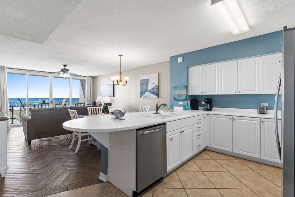 Kitchen - Stainless steel appliances and white cabinetry for all your cooking needs!