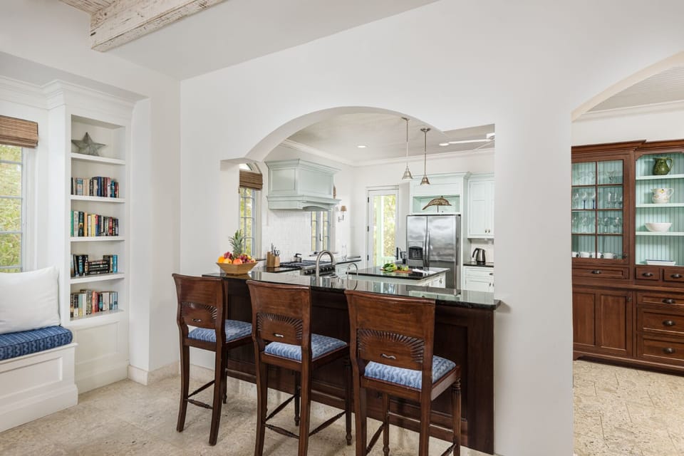 Complete with an open kitchen and bar stools