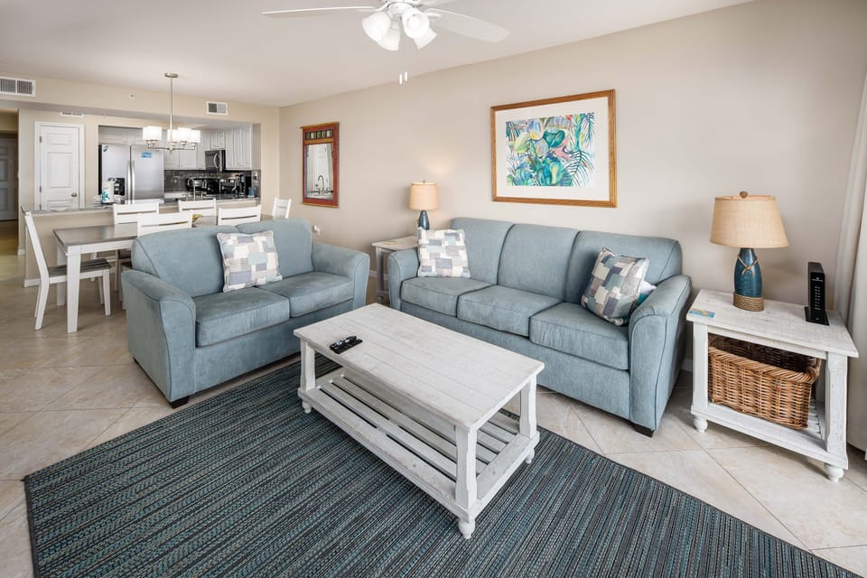 Livingroom - Plenty of comfortable furnishings allow for any group to enjoy a vacation. This sofa pulls out into a queen, accommodating two.