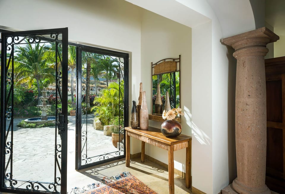 Walk through grand doors into the entrance of Villa Las Brisas!