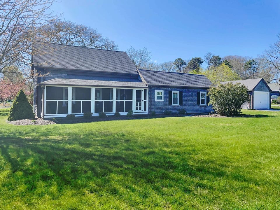Side view of the home, encompassing a spacious corner lot - 38 Pleasant Street Harwich Port Cape Cod New England Vacation Rentals