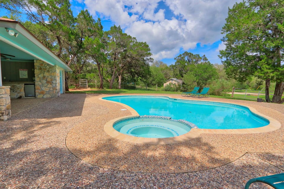 Swimming pool with lounging chairs